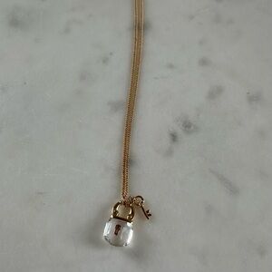 Elegant Gold Necklace with Lock and Key Pendant